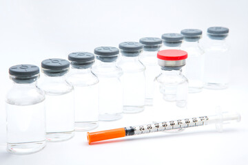 a bottle of vaccine on a white background