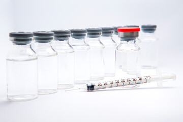 a bottle of vaccine on a white background