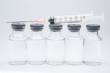 a bottle of vaccine on a white background