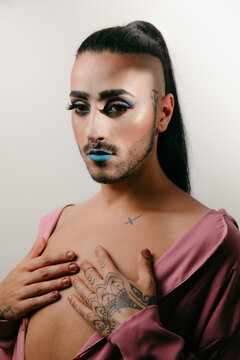 Stylish transgender woman posing at studio