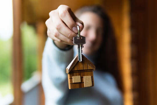 Unrecognizable woman with keys of new house