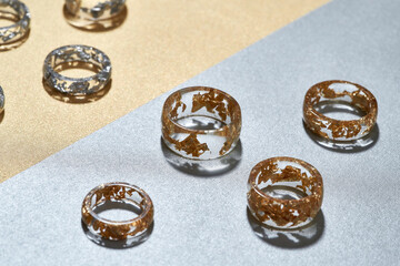 Studio shot of clear acrylic rings with golden filling
