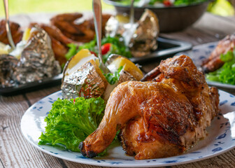 Grilled chicken with baked potato and salad
