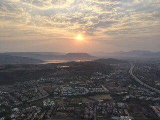 sunset over the city with beautiful view of lake and mountain