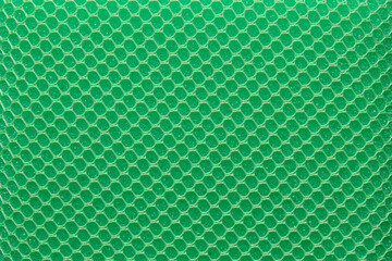 Full frame green hexagon mesh pattern background.