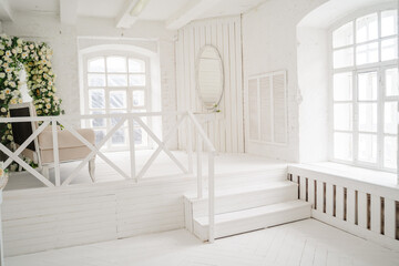 White veranda with table and sofa
