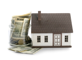 Figure of house and money on white background. Concept of buying real estate
