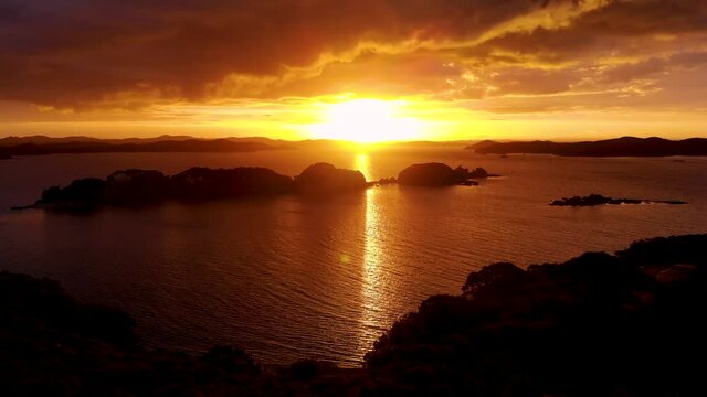 Sunset Over Poroporo Island In The Bay Of Islands, New Zealand - aerial shot
