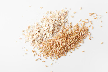 Flakes and peeled oat grains pile