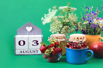 Calendar for August 3 : the name of the month of August in English, cubes with the numbers 0 and 3,...