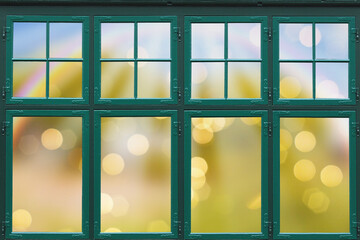 Creative layout with green window and colored defocused background with glowing bokeh behind....
