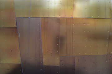 Copper metal plates with rivets and water stains. Muliti color metal background abstract metal patina