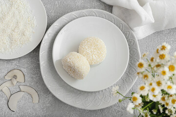 Plates with tasty Japanese mochi on table