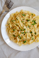Homemade One Pot Garlic Parmesan Pasta with Parsley, top view. Flat lay, overhead, from above.