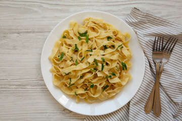 Homemade One Pot Garlic Parmesan Pasta with Parsley, top view. Flat lay, overhead, from above.