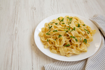 Homemade One Pot Garlic Parmesan Pasta with Parsley, side view. Space for text.