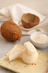 Plate with tasty coconut mochi on grunge background