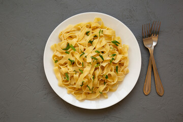 Homemade One Pot Garlic Parmesan Pasta with Parsley, top view. Flat lay, overhead, from above.