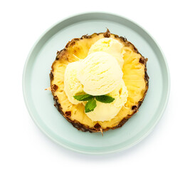 Plate with tasty pineapple ice cream on white background