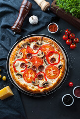 Pizza on a dark background  flat lay