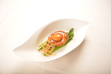 braised single whole big abalone seafood with vegetable and black truffle , ginseng in chef oyster sauce asian premium halal menu