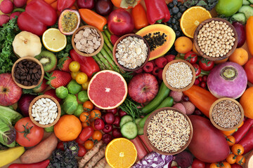 Antioxidant health food  to lower cholesterol and blood pressure with fruit, vegetables, cereals, legumes, grains, high in fibre, anthocyanins, lycopenes, carotenoids, vitamins, minerals. Flat lay.