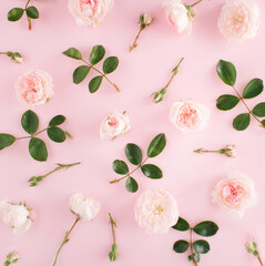 Spring pink flowers pattern on pastel pink background. Creative festive lay out with roses. Wedding ideas. Floral design. Romantic minimale concept. Flat lay. Top view.