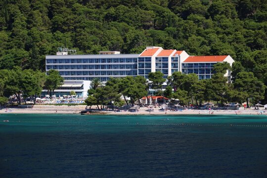 OREBIC, CROATIA - JULY 26, 2019: Luxury hotel seen from the sea in Orebic. Croatia had 18.4 million tourist visitors in 2018.
