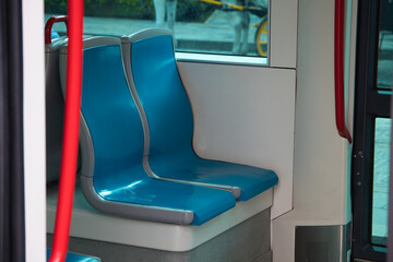 detail of empty chairs on a tram. Concept tourism, travel, holidays.