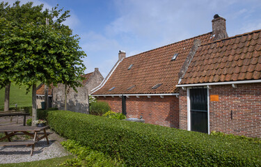Fototapeta na wymiar Waddenzee coast Moddergat Paesens Friesland Netherlands. Unesco world heritage. Village and historic fishermen houses.