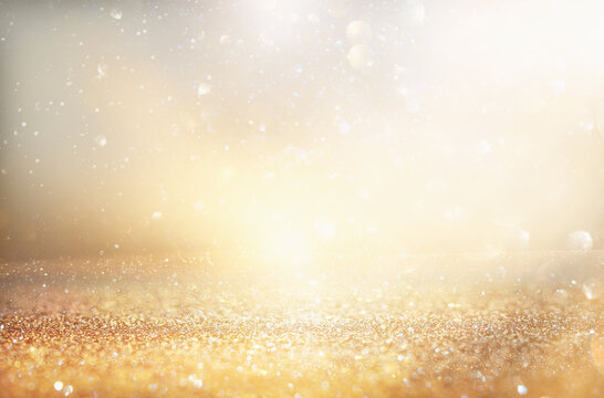 background of abstract gold and silver glitter lights. defocused