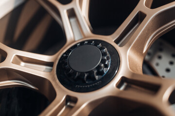 Sport car wheel close up with the central locking