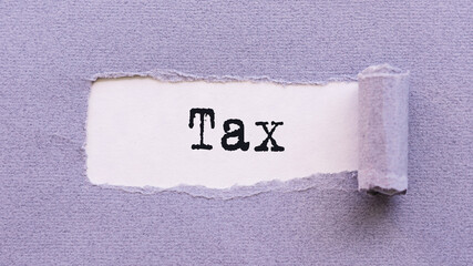 The text TAX appears on torn lilac paper against a white background.