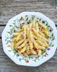  Italian home made   penne pasta  with  tuna  fish, parmesan cheese and black pepper .