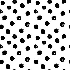Hand drawn vector seamless polka dot pattern. Realistic painted polka dot ornament in black and white.