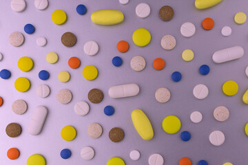 Background from pills. Different pills on a gray background.