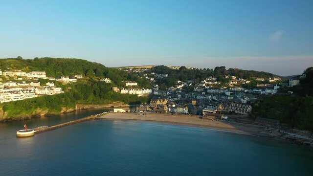 4K: Aerial Drone Video of Looe in Cornwall, England, UK. Flying around the Coastline of the town. Banjo Pier. Stock Video Clip Footage