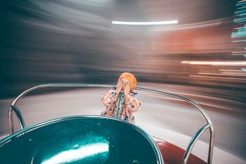 Little girl on the roundabout.