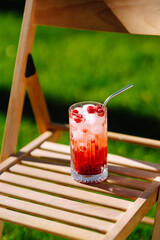 Alcoholic and non-alcoholic summer drinks with ice cubes of lemon, lime, fruits and mint. Summer holiday tropical concept.