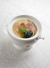 double boiled luxury seafood shark's fin crab meat and mushroom thick soup in hot clay pot asian premium halal menu