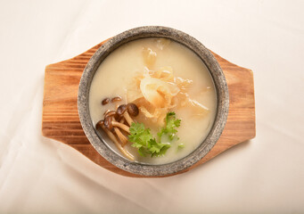 double boiled luxury seafood shark's fin crab meat and mushroom thick soup in hot clay pot asian...