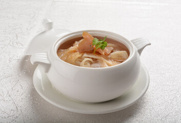 double boiled luxury seafood shark's fin crab meat and mushroom thick soup in hot clay pot asian...