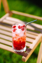 Alcoholic and non-alcoholic summer drinks with ice cubes of lemon, lime, fruits and mint. Summer holiday tropical concept.