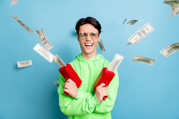 Photo of crazy handsome young gentleman wear green sweatshirt smiling shooting money weapons...