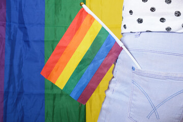 Rainbow LGBT flag in the back pocket of jeans, concept of gender equality.