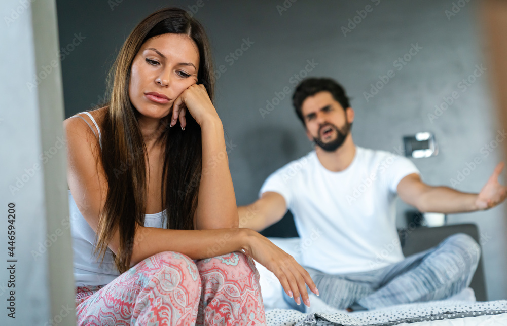 Wall mural Couple having arguments and sexual problems in bed