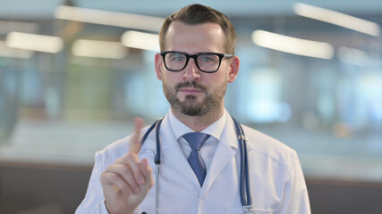 Portrait of No Sign by Young Male Doctor by Finger Gesture