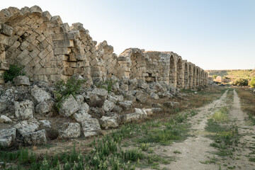 Fototapeta na wymiar Located in the ancient city of Perge, the stadium is one of the best stadiums that have survived from the ancient period. Antalya, Turkey