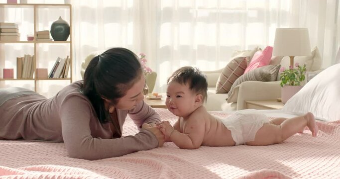 Young mom taking care of baby girl,4K
