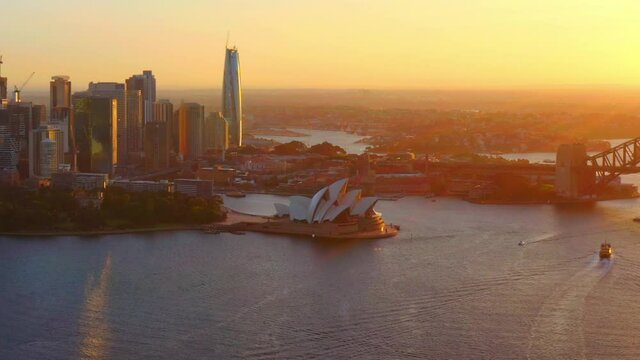 High-rise Buildings And Skyscrapers At Sydney CBD - Sydney Opera House And Harbour Bridge At Golden Hour In Australia. - aerial